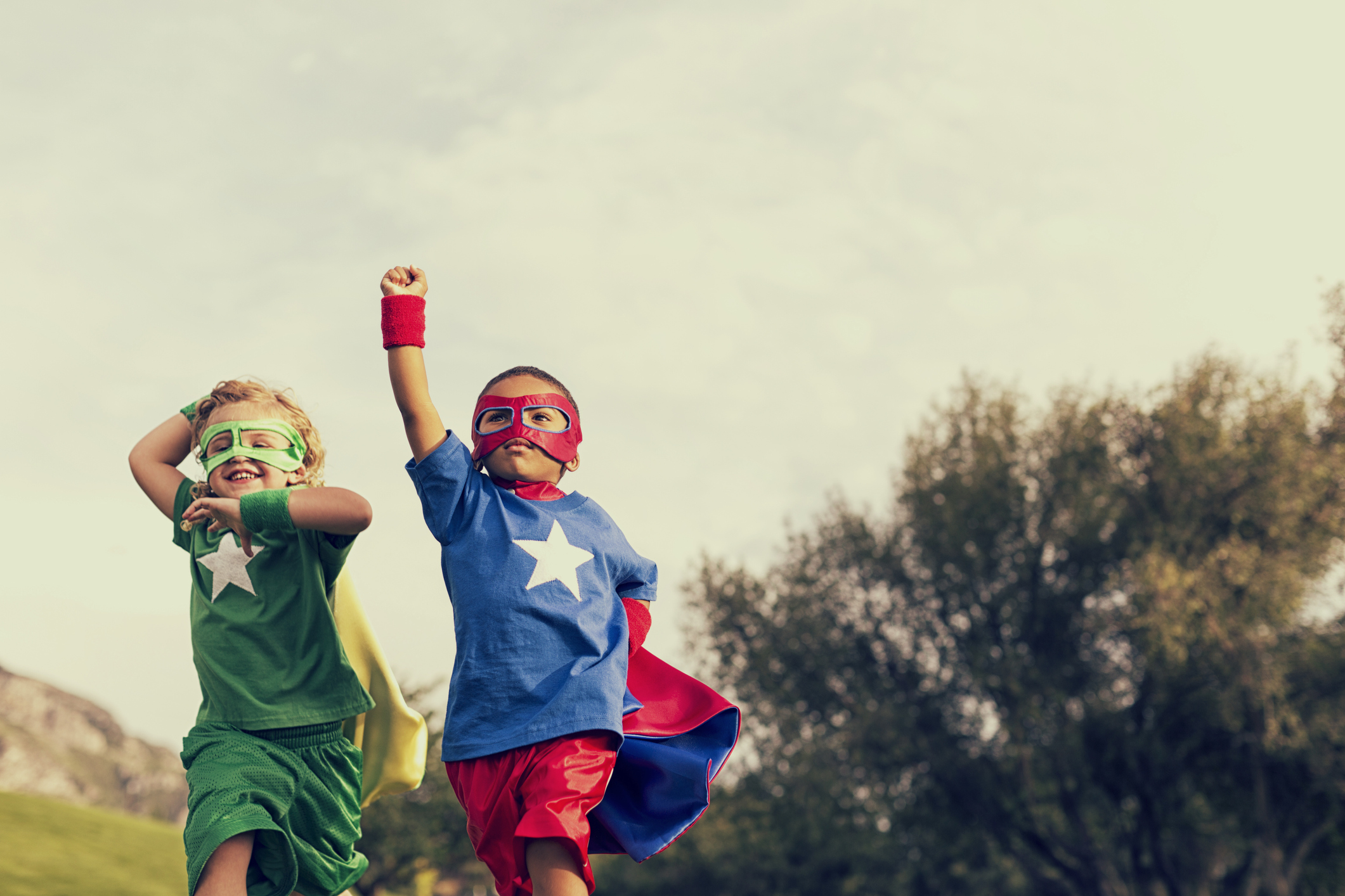 two kids dressed as superheroes
