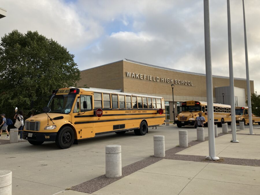 buses gathered in parking lot on first day of school