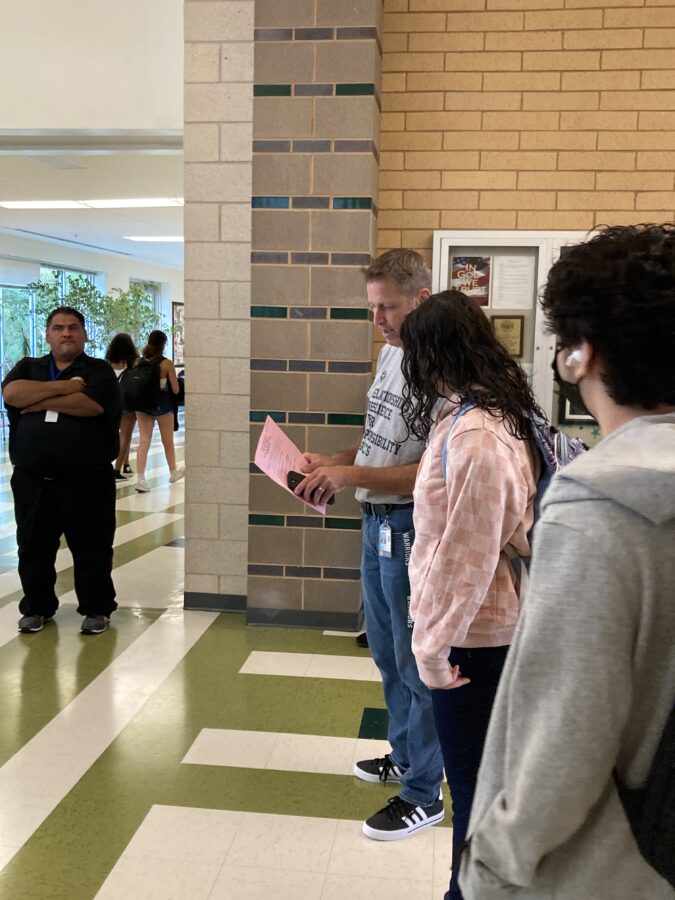 staff directing students on first day of school