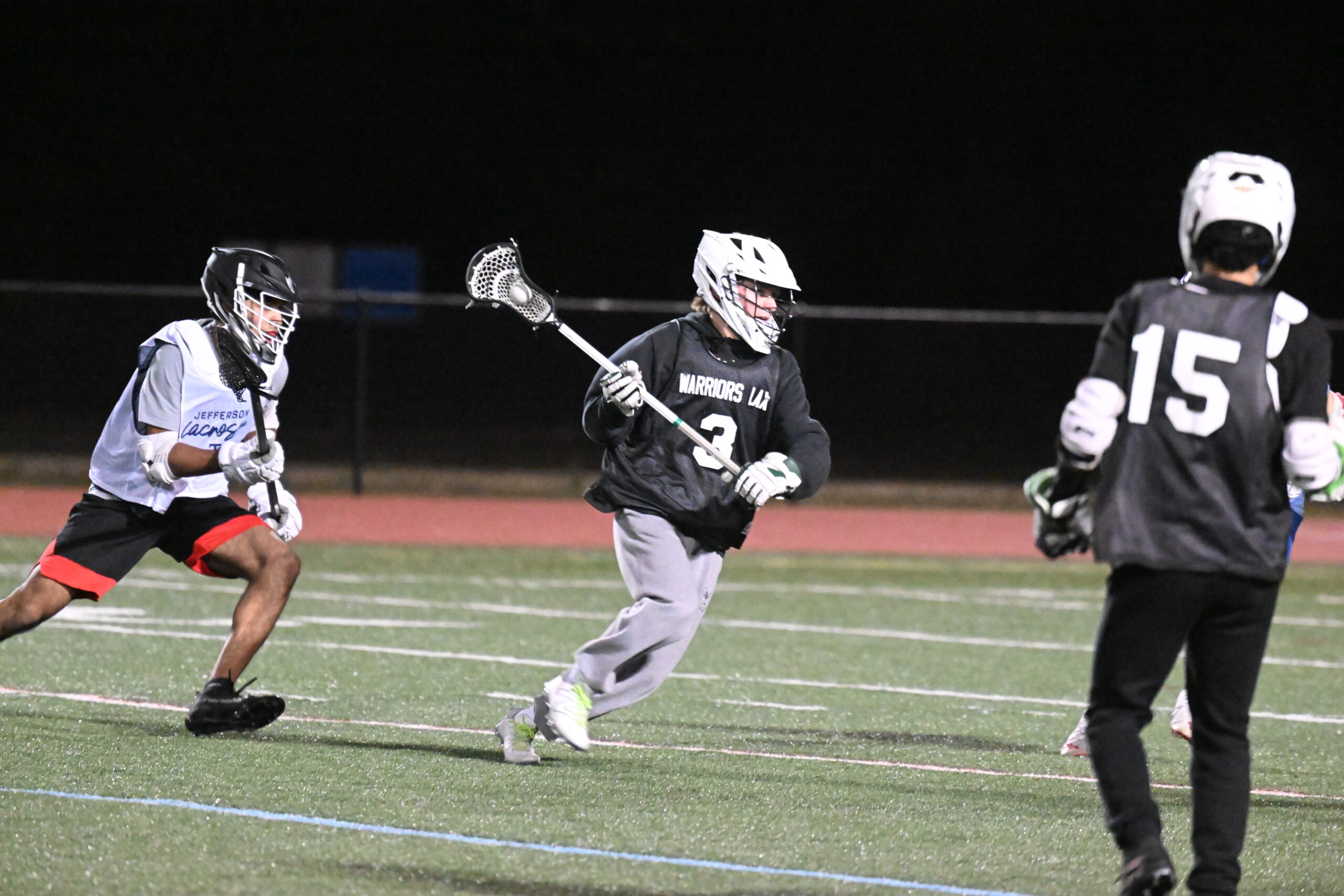 WHS lacrosse player in action