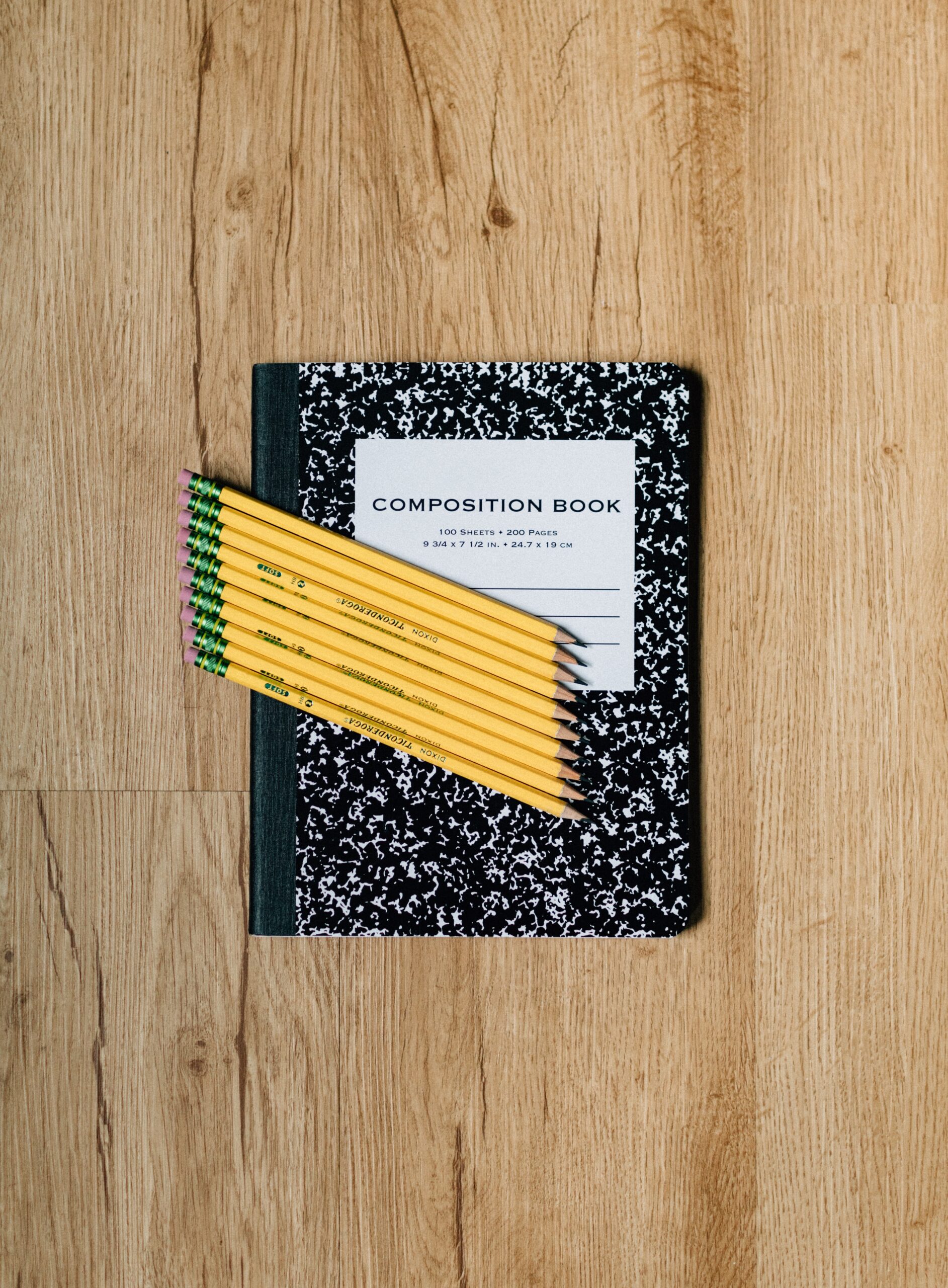 pencils on a marbled notebook