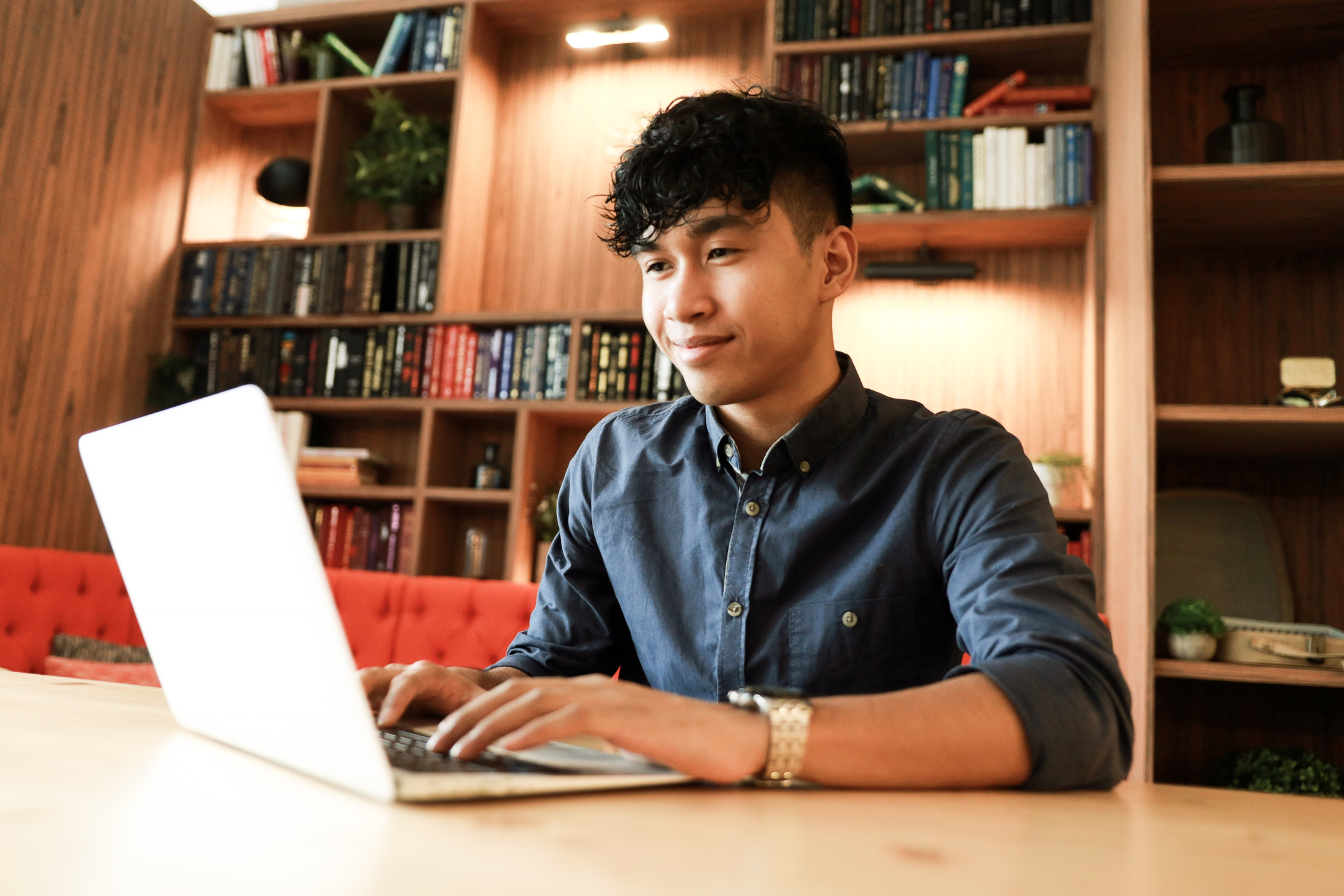 Asian student on a computer in the library