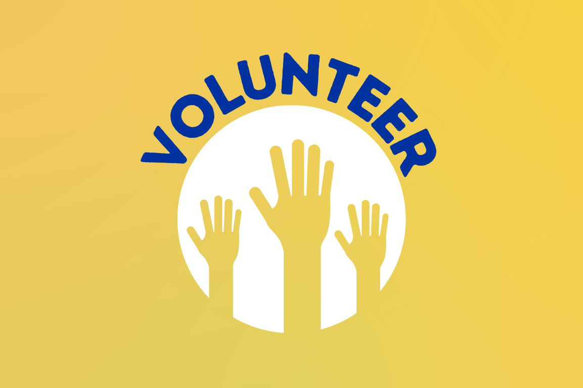 volunteer with hands raised in circle