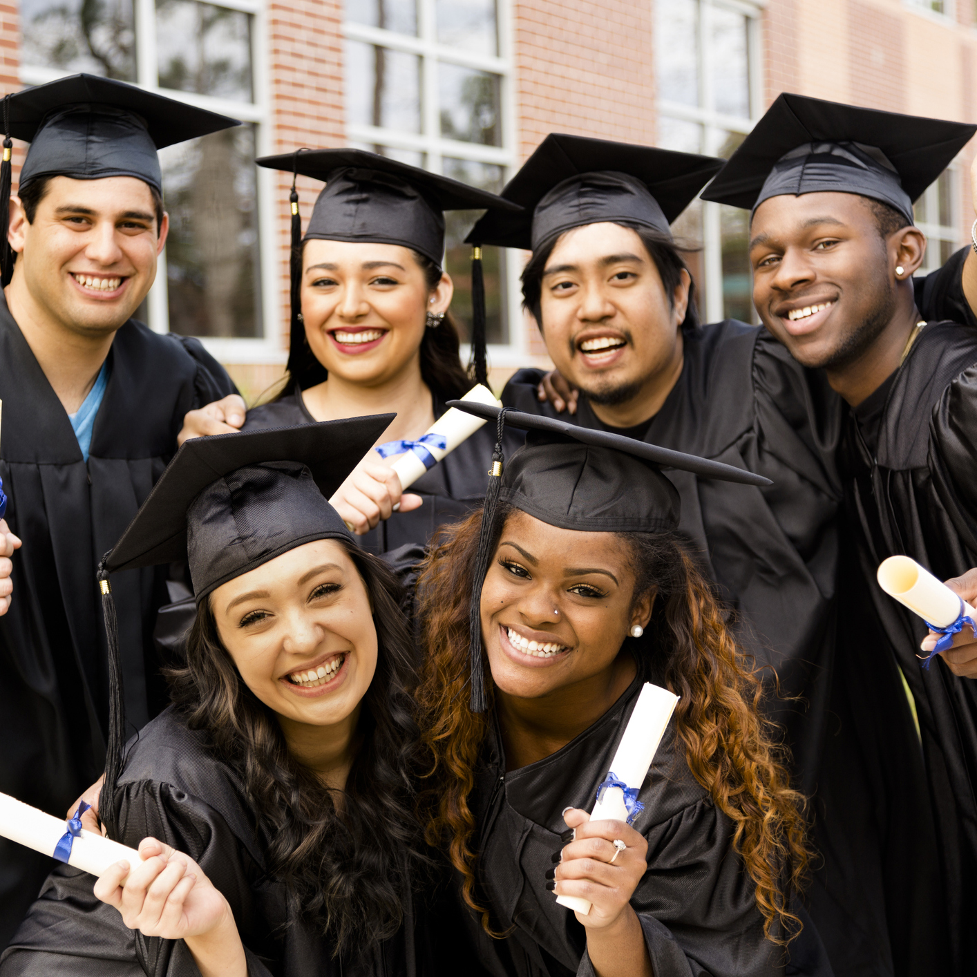 group of graduates in cap & gown