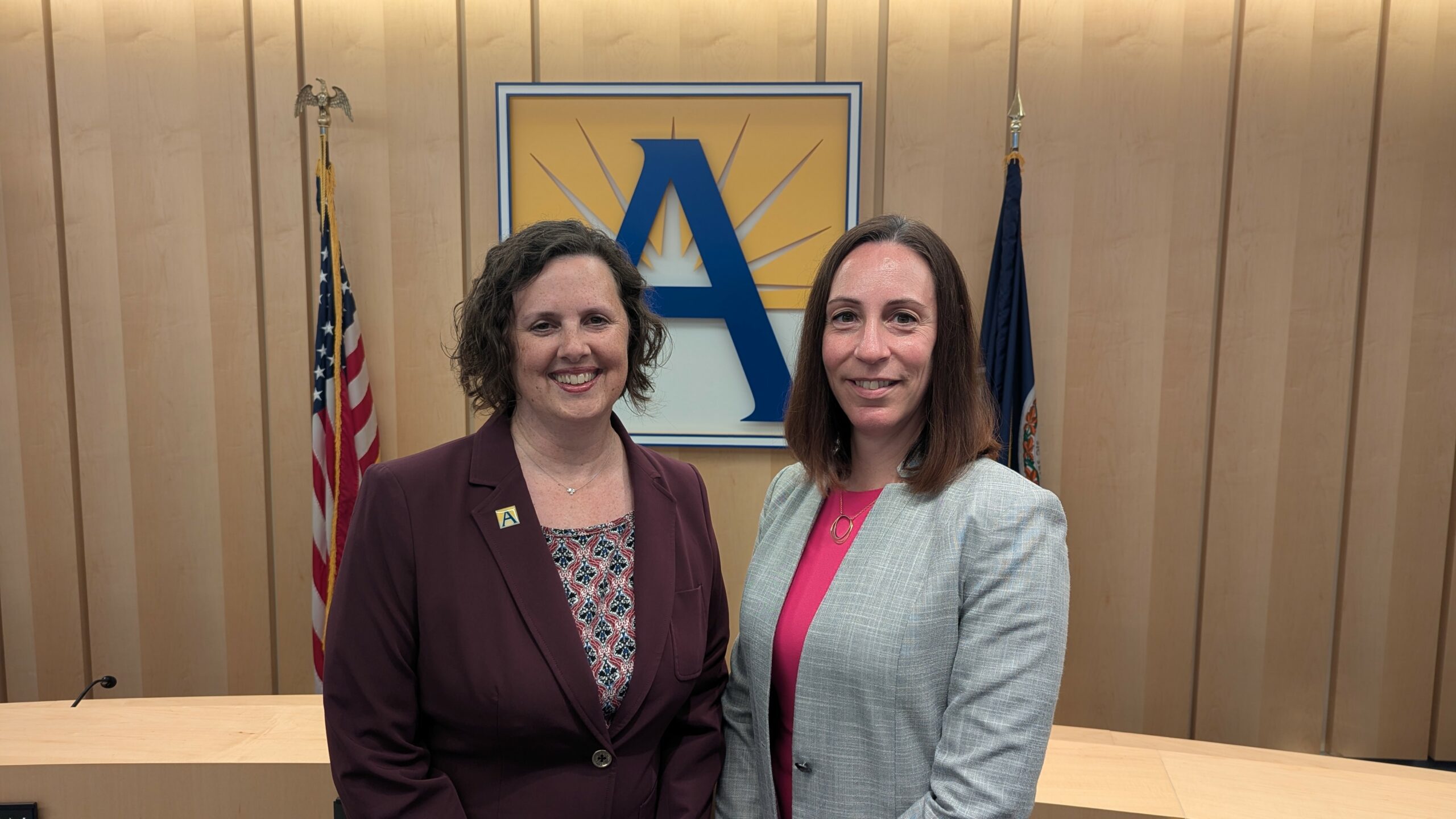Bethany Zecher Sutton and Miranda Turner in front of APS "A"