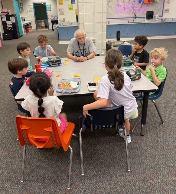 Dr. A at lunch with students