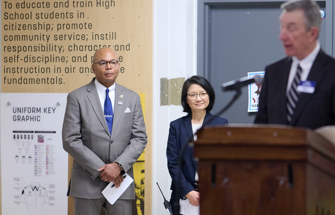 Mr Frazier and Margaret Chung listening to speaker