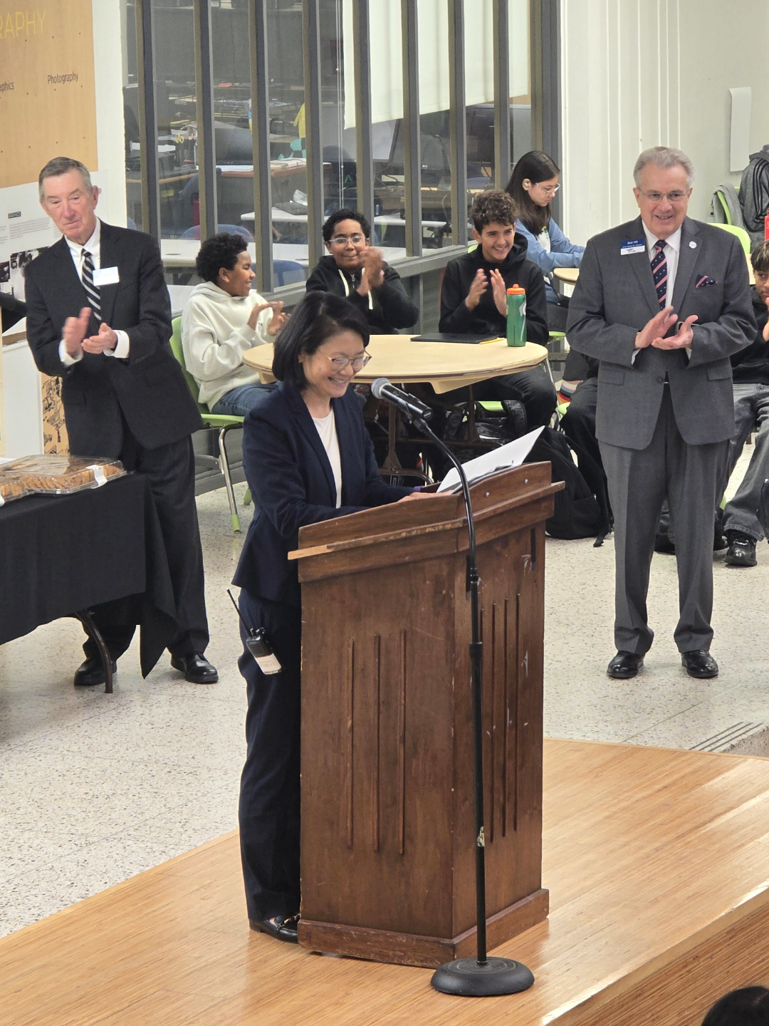 Margaret Chung speaking with students in background