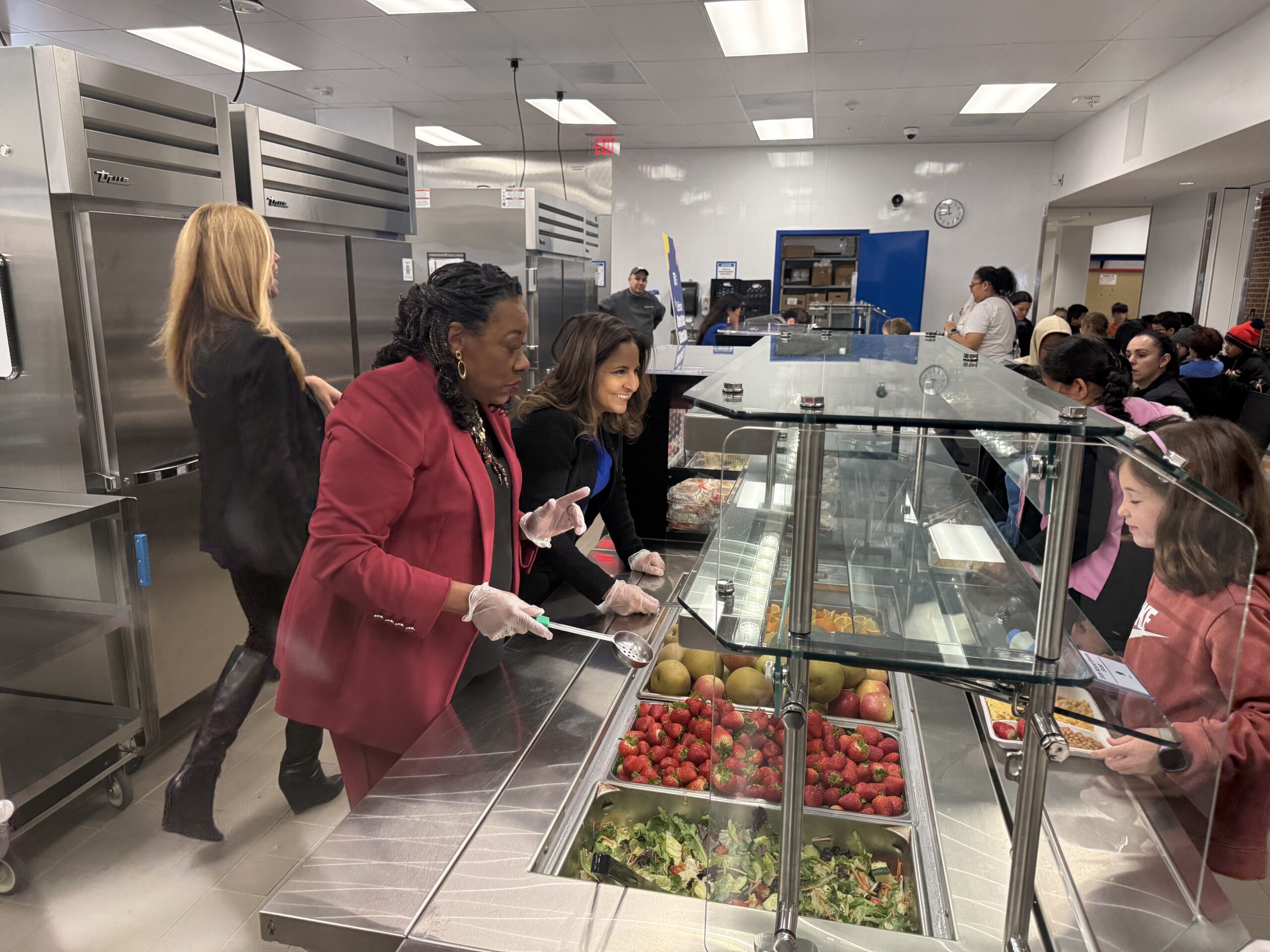 NEA President Becky Pringle and June Prakash serve lunch
